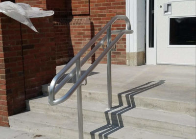 Aluminum handrail in school entry stairs