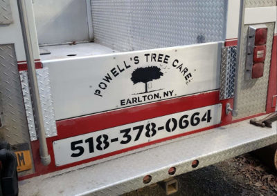 Powell's Tree Care logo on a truck tailgate